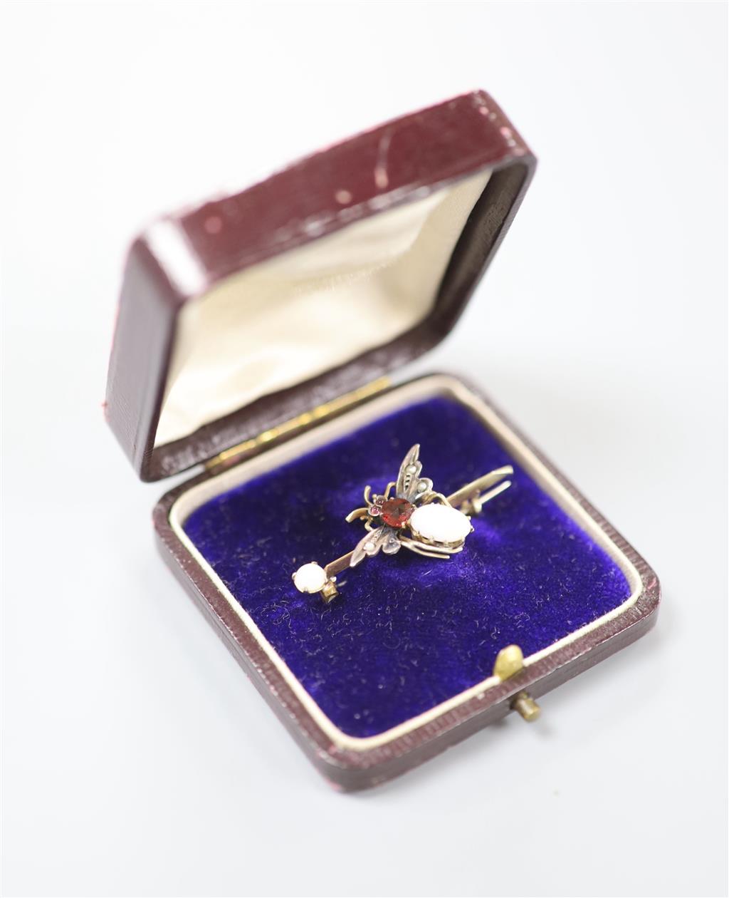 A Victorian yellow and white metal, white opal, garnet and seed pearl set bug brooch, 37mm, gross 2.7 grams.